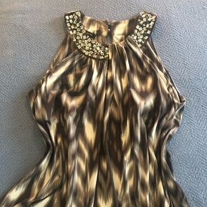 INC sleeveless jeweled top.